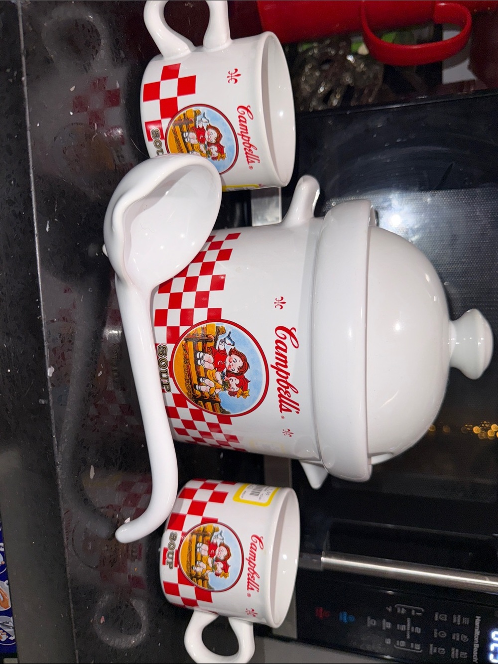 Vintage Campbell's Soup Kids ceramic soup tureen set with a matching ladle.